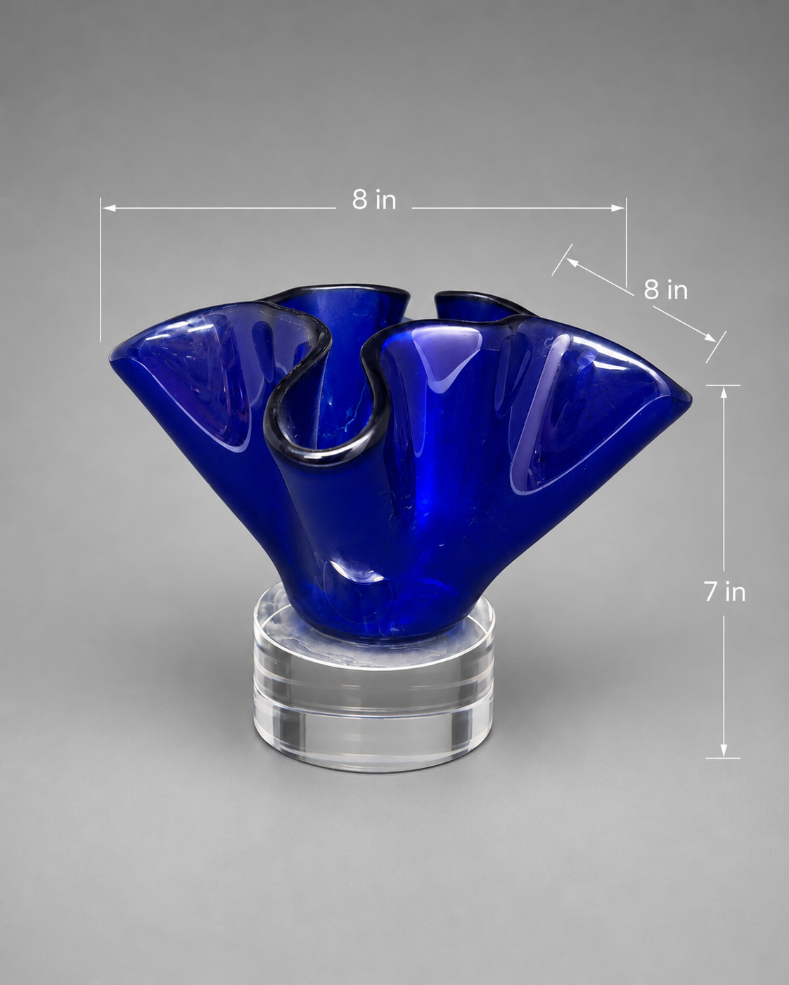 blue bloomed glass vase on clear stand with measurements. 8 inches wide. 8 inches long. 7 inches tall