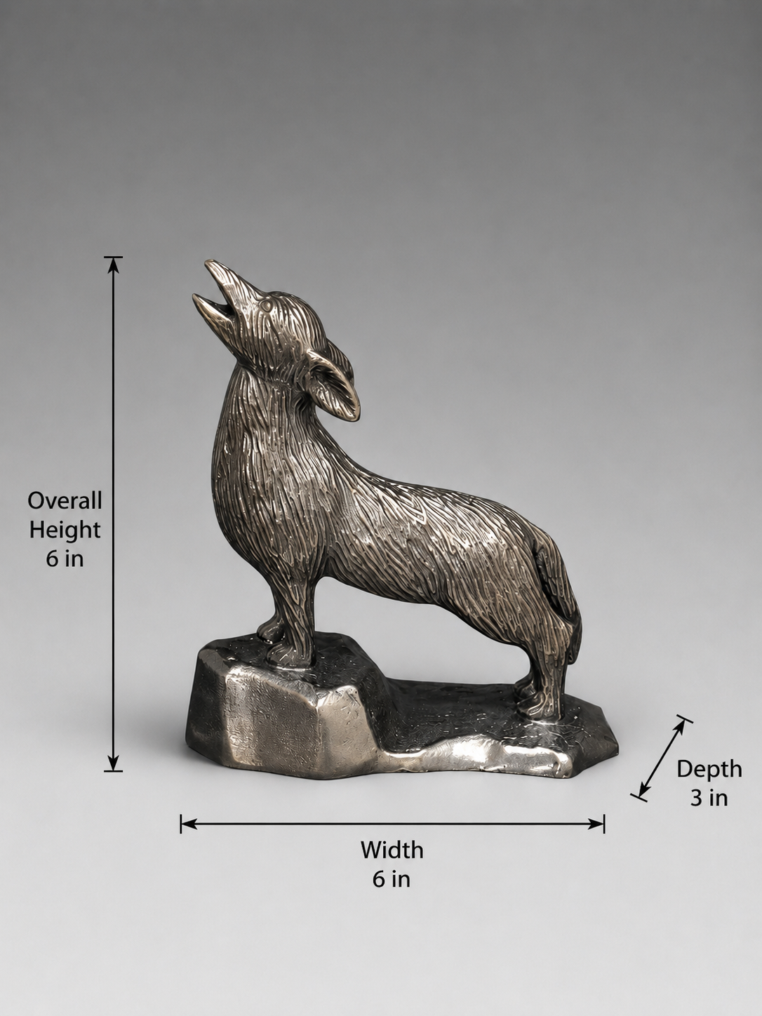 Metallic howling coyote sculpture measuring 6 inches wide, 3 inches deep, and 6 inches tall.