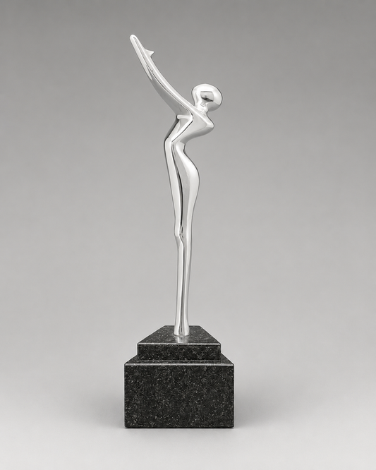 Front view of a polished silver abstract human figure reaching upward on a stepped black marble base against a neutral gray background.