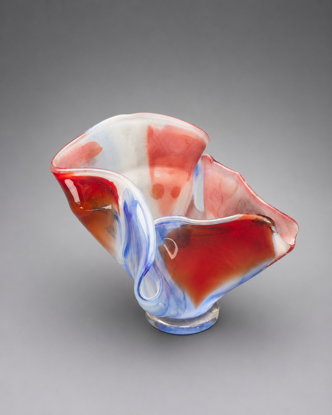 side view of an exotic multi-color vase that blooms outward