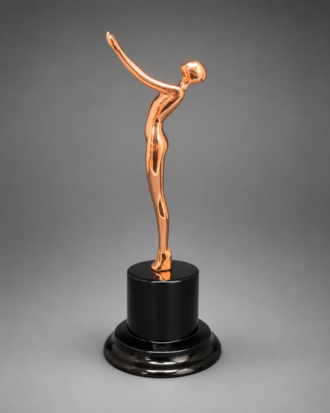 Angled view of the rose gold Victory Motion Trophy featuring a reflective metallic finish and premium black base.