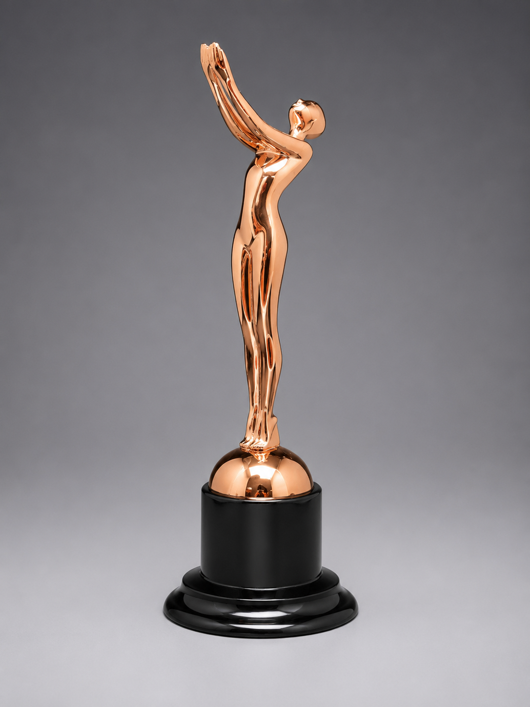 Victory Motion Bronze Trophy with a rose bronze metallic finish, abstract victory figure, and glossy black pedestal base on a neutral gray background.