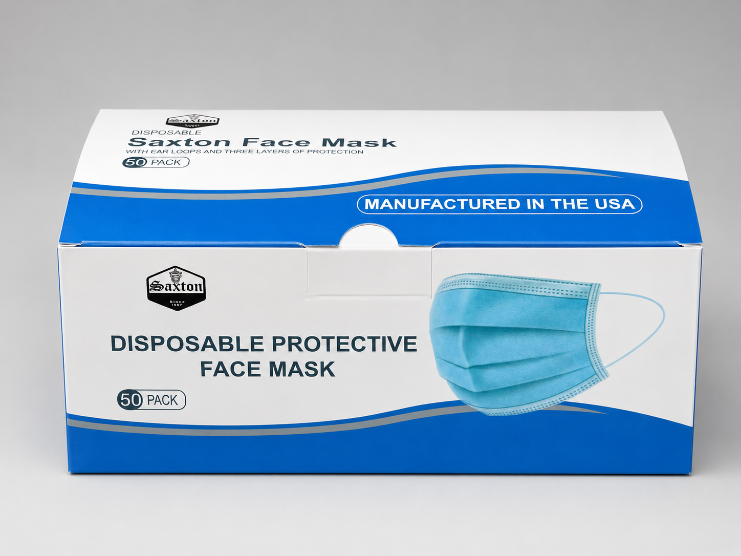 Top view of the Saxton Disposable Face Mask box featuring the Saxton logo, "Manufactured in the USA" label, product branding, and 50-pack packaging with clean white and blue graphics.