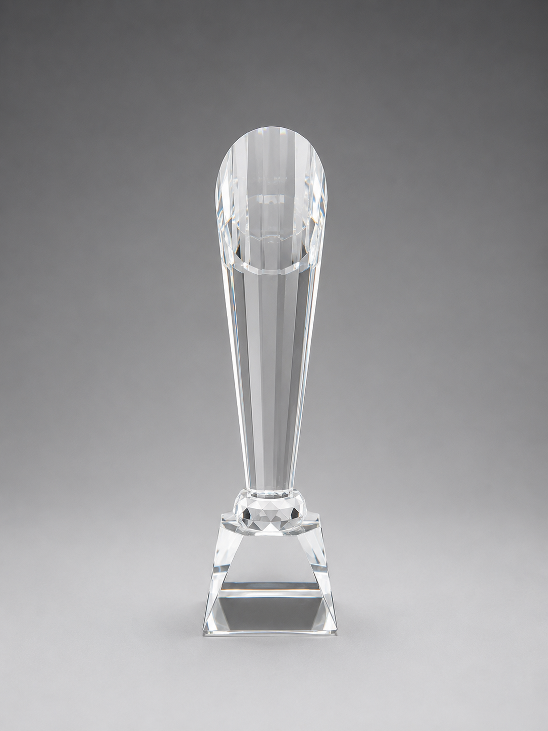  back view of Clear glass trophy on a gray background
