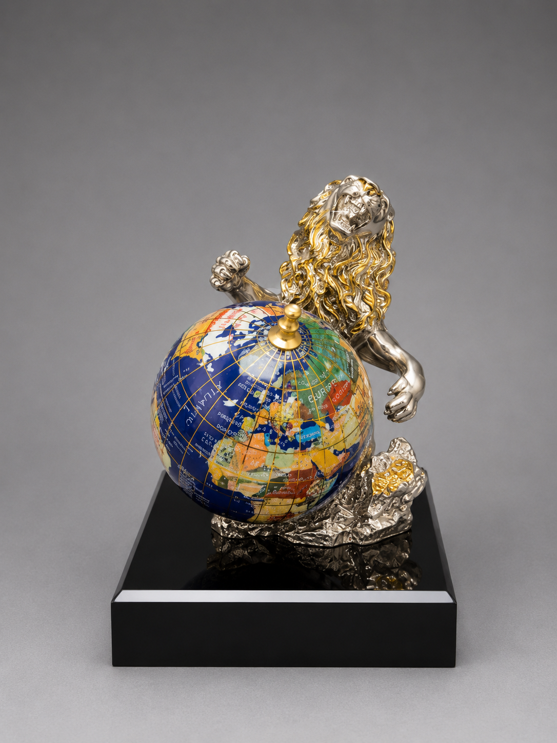Front view of Decorative sculpture of a lion with a globe on a gray background