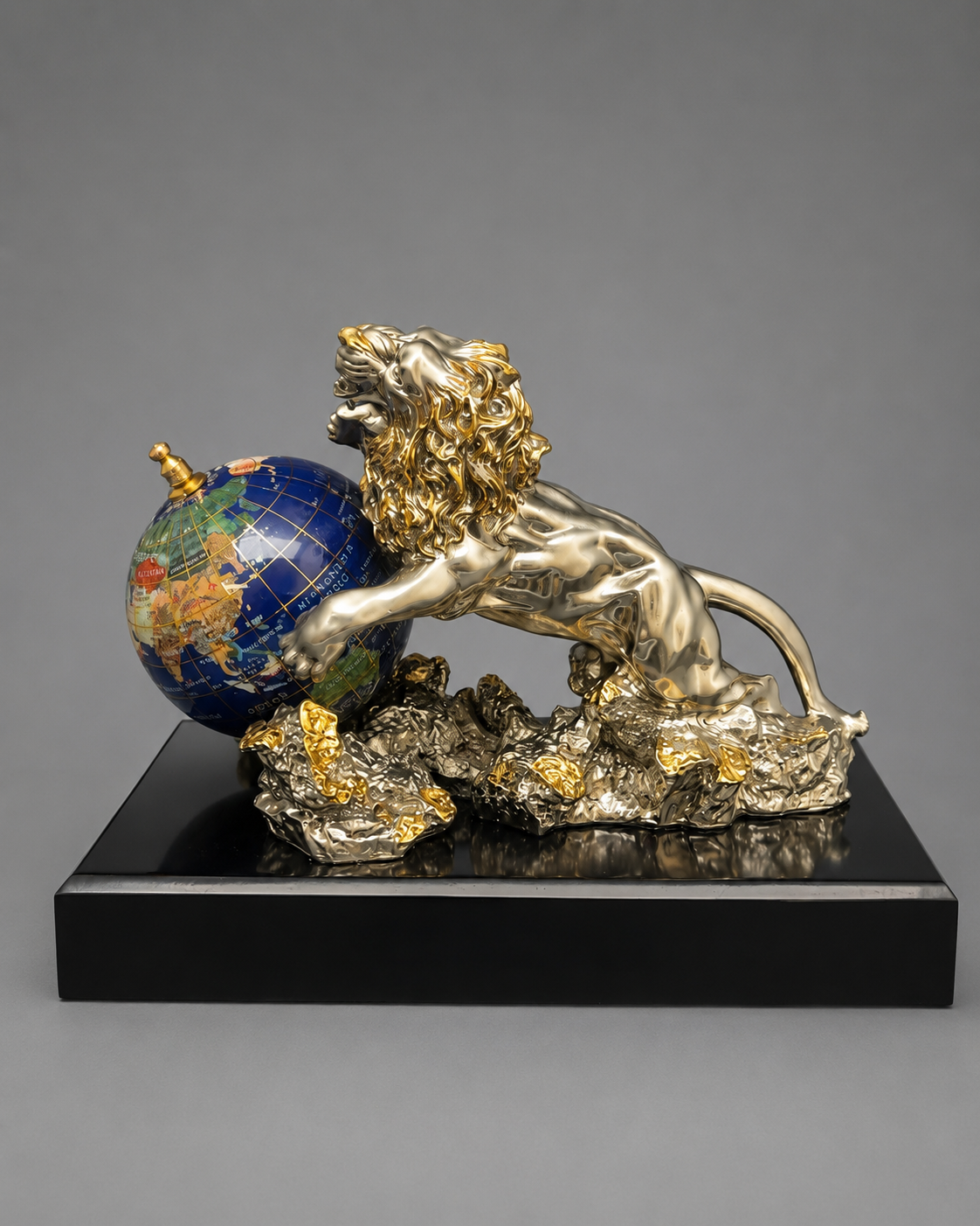 Decorative sculpture of a lion with a globe on a gray background