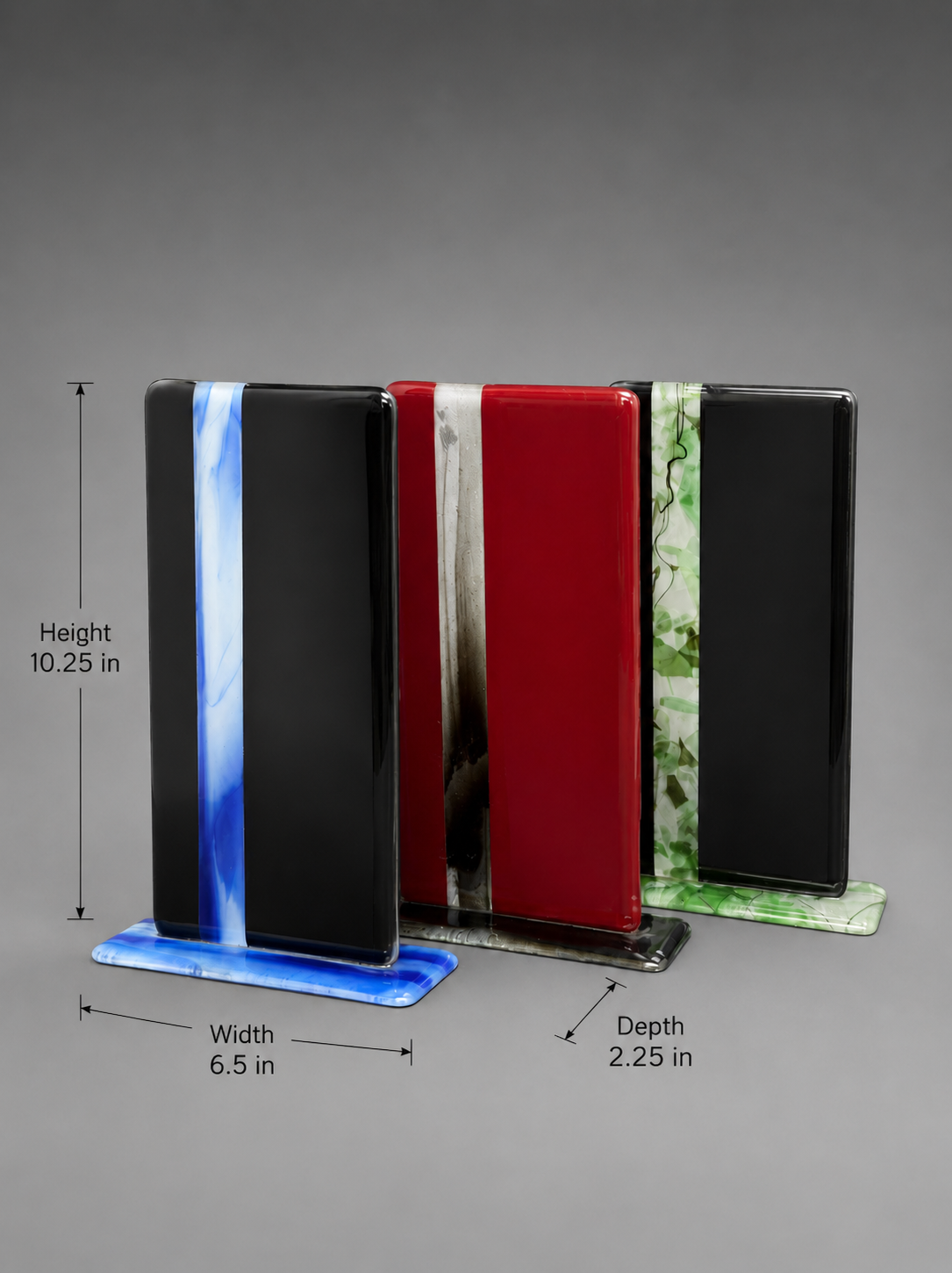 Three rectangular glass pieces with different color patterns on a gray background with measurements. Height 10.25 inches. width 6.5 inches. Depth 2.25 inches.