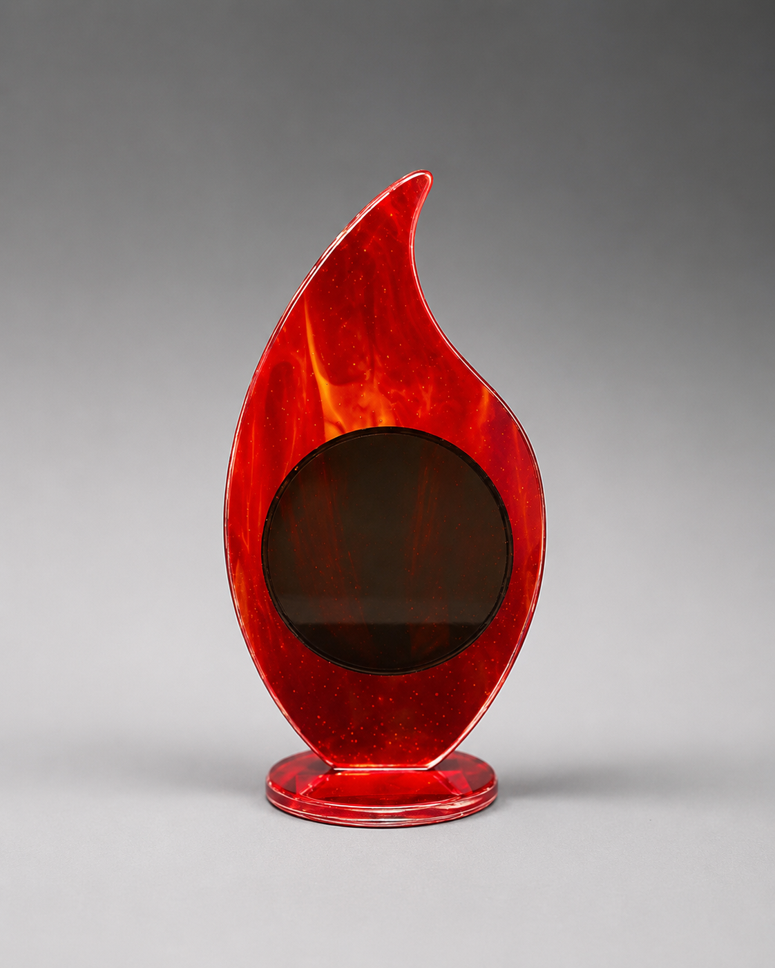Red flame-shaped plaque on a gray background